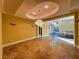 Elegant dining room featuring a modern chandelier and decorative wall sconces at 9909 Moon Valley Pl, Las Vegas, NV 89134