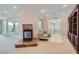 Sitting room with fireplace, sitting chairs, hardwood bookcase and access to an outdoor patio at 9909 Moon Valley Pl, Las Vegas, NV 89134