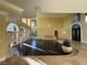 Spacious living area featuring hardwood floors, arched windows, fireplace and recessed lighting at 9909 Moon Valley Pl, Las Vegas, NV 89134