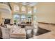 Spacious living room featuring fireplace, hardwood floors, and natural light at 9909 Moon Valley Pl, Las Vegas, NV 89134