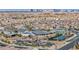 A panoramic aerial view of a Las Vegas community with city skyline and amenities at 10096 Amethyst Hills St, Las Vegas, NV 89148