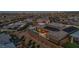 Aerial view of a home featuring solar panels, an outdoor pool, and a cozy fire pit area at 10096 Amethyst Hills St, Las Vegas, NV 89148