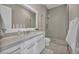 Modern bathroom with sleek vanity, large mirror, and walk-in shower at 10096 Amethyst Hills St, Las Vegas, NV 89148