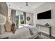 Cozy bedroom featuring a comfortable bed, large TV, and stylish decorations at 10096 Amethyst Hills St, Las Vegas, NV 89148