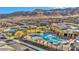 Aerial view of a community pool with a covered area and neighborhood homes in the background at 10096 Amethyst Hills St, Las Vegas, NV 89148