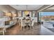 Elegant dining room with chandelier, stylish furniture, and access to the backyard at 10096 Amethyst Hills St, Las Vegas, NV 89148