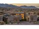 Beautiful modern home featuring professional landscaping and a brick paver driveway at sunset at 10096 Amethyst Hills St, Las Vegas, NV 89148