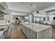 Open-concept kitchen with island, stainless steel appliances, and dining area at 10096 Amethyst Hills St, Las Vegas, NV 89148