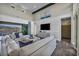 Comfortable living room featuring a sectional sofa, wood floors, and a sliding door with mountain views at 10096 Amethyst Hills St, Las Vegas, NV 89148