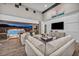 A comfortable living room with modern decor and a seamless transition to an outdoor living space at 10096 Amethyst Hills St, Las Vegas, NV 89148