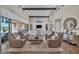 Expansive living room with high ceilings, modern furnishings, and access to outdoor space at 10096 Amethyst Hills St, Las Vegas, NV 89148
