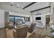 Open-concept living area with hardwood floors, high ceilings, and access to a relaxing outdoor space at 10096 Amethyst Hills St, Las Vegas, NV 89148