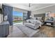 Main bedroom featuring hardwood floors, large windows with views, and modern furnishings at 10096 Amethyst Hills St, Las Vegas, NV 89148
