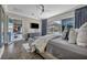 Inviting main bedroom with a view, plush bedding, and a comfortable sitting area at 10096 Amethyst Hills St, Las Vegas, NV 89148