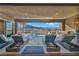 Inviting outdoor patio offers a serene retreat with lounge chairs, a water feature, and a built-in barbecue at 10096 Amethyst Hills St, Las Vegas, NV 89148