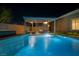 Inviting outdoor pool area with waterfall feature and covered lounge space at 10096 Amethyst Hills St, Las Vegas, NV 89148