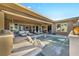 Stunning outdoor pool and patio area featuring a waterfall, swim-up seating, and a cozy dining space at 10096 Amethyst Hills St, Las Vegas, NV 89148