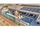 Backyard with a pool, spa, outdoor kitchen, and lounge chairs at 10096 Amethyst Hills St, Las Vegas, NV 89148