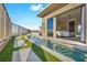 Luxurious pool with water feature offers direct access to the main bedroom with sliding glass doors at 10096 Amethyst Hills St, Las Vegas, NV 89148