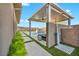 Outdoor shower area with convenient access to the modern pool area and nearby seating under the patio at 10096 Amethyst Hills St, Las Vegas, NV 89148