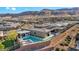 Backyard oasis with a pool, spa, and covered patio for outdoor living at 10096 Amethyst Hills St, Las Vegas, NV 89148