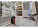 Organized walk-in closet featuring shelving, drawers, clothing rods, and storage solutions for efficient space utilization at 10096 Amethyst Hills St, Las Vegas, NV 89148