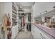 Well-organized walk-in closet with ample shelving, drawers, and hanging space for clothes and accessories at 10096 Amethyst Hills St, Las Vegas, NV 89148