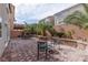 Backyard features pavers, lush palm trees, and seating area at 10145 Arbor Brook Ct, Las Vegas, NV 89141