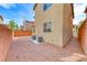 Low-maintenance backyard with gravel landscaping, AC units, and a brick perimeter wall at 10418 Poplar Park, Las Vegas, NV 89166