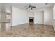 Open living room featuring tile floors, neutral walls, fireplace, and connected to other rooms at 10720 Sprucedale Ave, Las Vegas, NV 89144