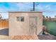 The shed features a window and a sturdy metal door, perfect for additional storage space and convenient backyard access at 1216 Oahu St, Las Vegas, NV 89104