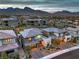 Aerial view of a modern home with a desert-landscaped front yard at 12356 Grey Dunes Ave, Las Vegas, NV 89138