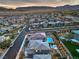 Overhead shot with manicured lawns, pools, and lush landscaping creating an inviting outdoor space at 12356 Grey Dunes Ave, Las Vegas, NV 89138