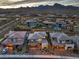 Aerial view of a residential neighborhood with mountain views and well-maintained homes at 12356 Grey Dunes Ave, Las Vegas, NV 89138