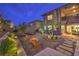 Beautiful backyard featuring a fire pit, patio, and beautifully landscaped garden, perfect for relaxation and entertainment at 12356 Grey Dunes Ave, Las Vegas, NV 89138