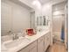 Bathroom features double sinks, plenty of counter space and white cabinets at 12356 Grey Dunes Ave, Las Vegas, NV 89138