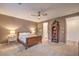 Bedroom with neutral walls, a ceiling fan, soft carpet and a full size bed at 12356 Grey Dunes Ave, Las Vegas, NV 89138