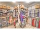 Walk-in closet with shelving, hanging rods, and ample storage space at 12356 Grey Dunes Ave, Las Vegas, NV 89138