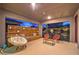 Outdoor patio featuring stylish seating, decorative wood wall, and privacy screen at 12356 Grey Dunes Ave, Las Vegas, NV 89138