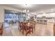 Open dining area with access to the patio, seamlessly connected to the kitchen and living room at 12356 Grey Dunes Ave, Las Vegas, NV 89138