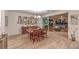 Dining area with wood table, slider to the patio, and decorative wall art at 12356 Grey Dunes Ave, Las Vegas, NV 89138