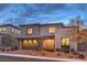 Modern two-story residence with stylish facade, attached garage, and desert landscaping at 12356 Grey Dunes Ave, Las Vegas, NV 89138