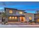 Contemporary two-story home with a two-car garage and well-maintained landscaping at 12356 Grey Dunes Ave, Las Vegas, NV 89138