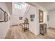 Bright and airy foyer with hardwood floors, staircase, and stylish decor at 12356 Grey Dunes Ave, Las Vegas, NV 89138