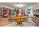 Bright living room with stylish decor, comfortable seating, and access to the outdoor patio at 12356 Grey Dunes Ave, Las Vegas, NV 89138