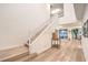 Bright foyer featuring a staircase with white railings and hardwood floors at 12356 Grey Dunes Ave, Las Vegas, NV 89138