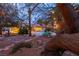 Serene backyard featuring a pool, fountain, mature trees, and tasteful landscaping at 1561 Doran Dr, Las Vegas, NV 89123