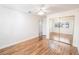 Bright bedroom with wood floors and a closet with mirrored doors at 1561 Doran Dr, Las Vegas, NV 89123