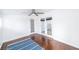Well-lit room featuring hardwood floors, shuttered windows, and a ceiling fan at 1561 Doran Dr, Las Vegas, NV 89123