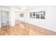Bright bedroom with wood floors and a window with plantation shutters at 1561 Doran Dr, Las Vegas, NV 89123